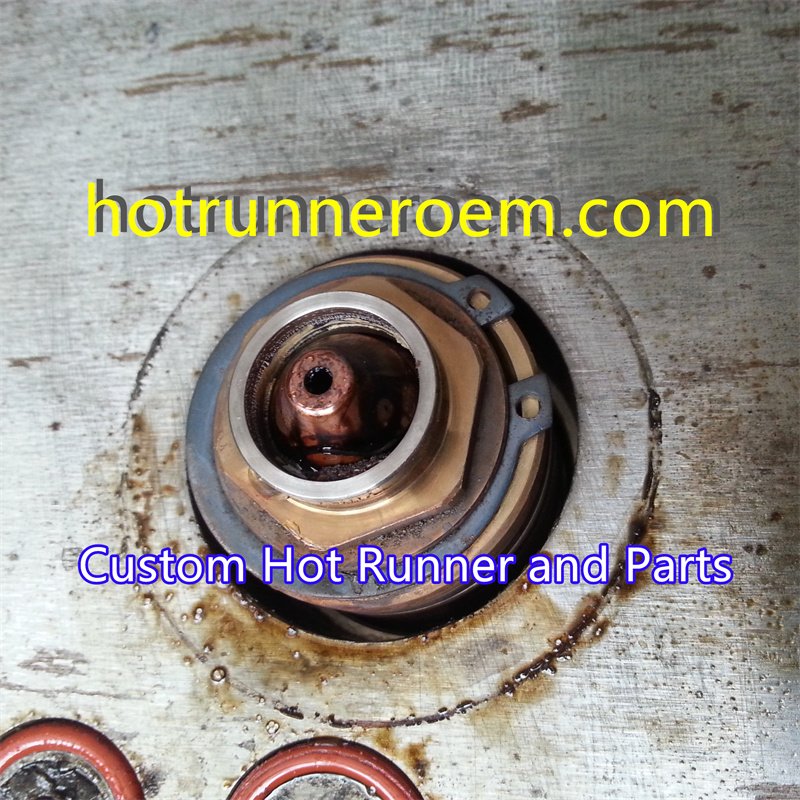 hot runner manifold nozzle leak prevention